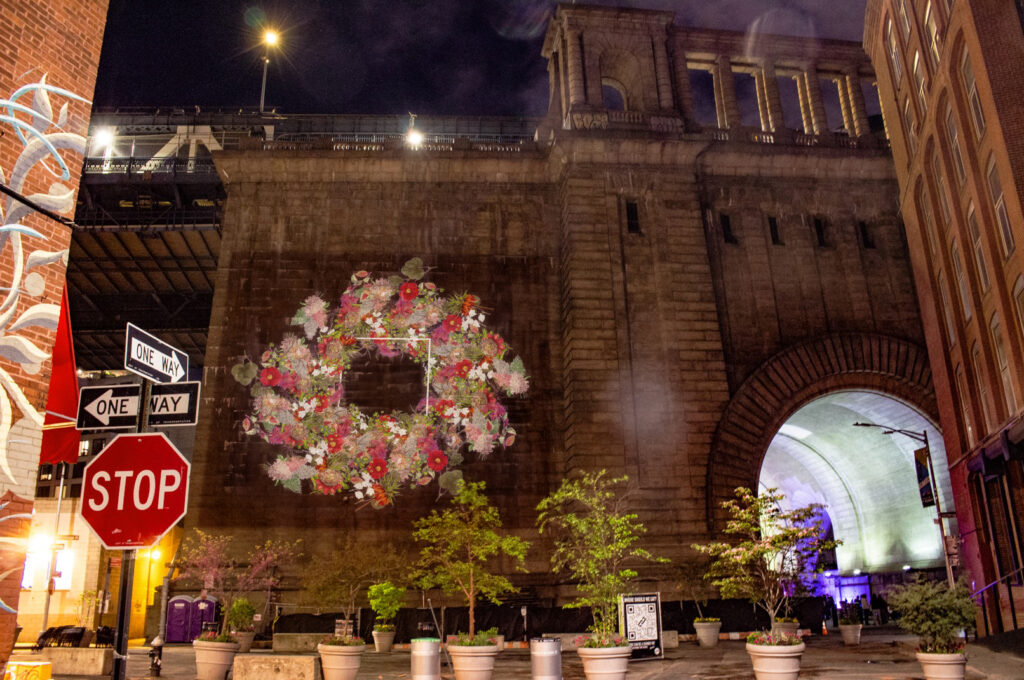 NYC DUMBO Improvement District - Community + Small Business - Winter 2024 Projections - The DUMBO Projection Project - Victorian Flowers Archway